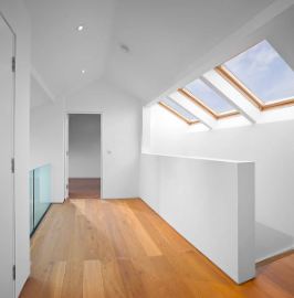 Loft landing with oak floor and roof lights